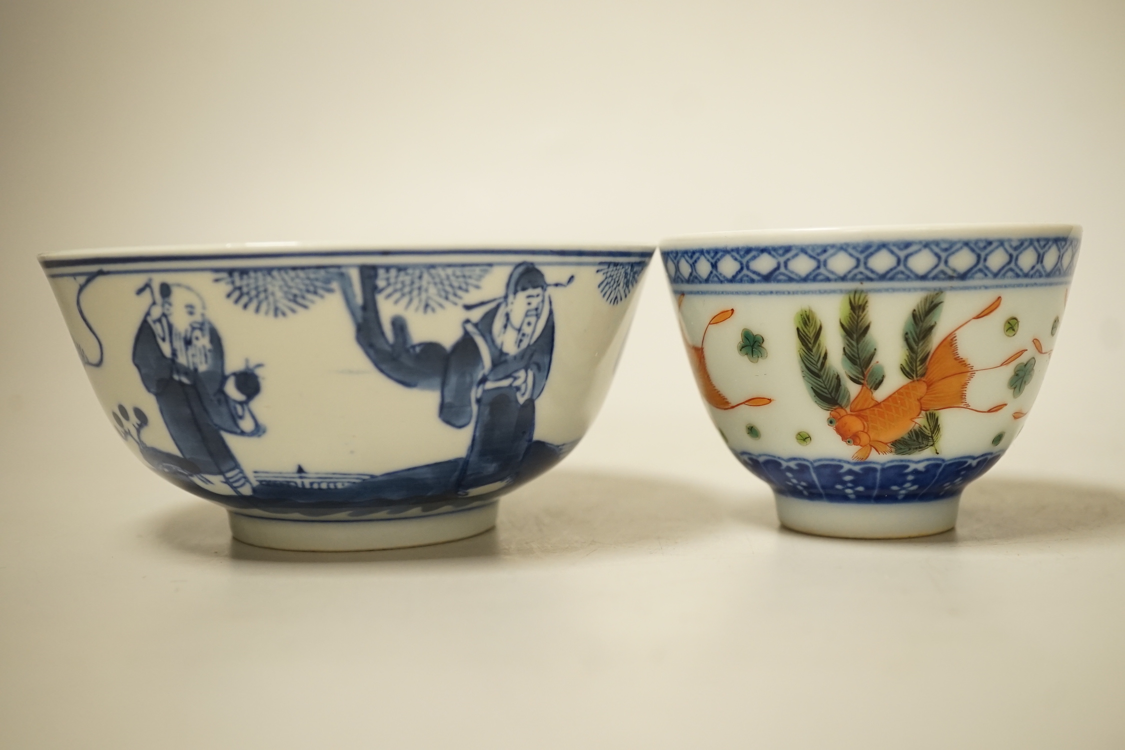 A 19th century Chinese blue and white bowl, an enamelled goldfish cup and two snuff bottles